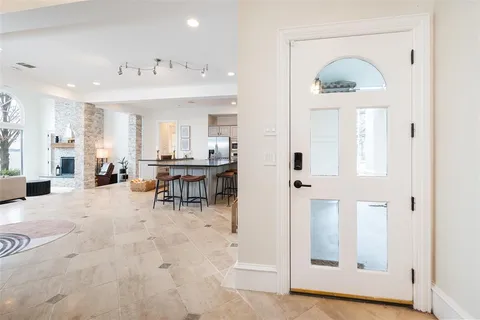 a kitchen with stainless steel appliances kitchen island granite countertop a sink and cabinets