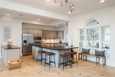 a living room with furniture and a dining table