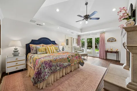 a bedroom with bed and a chandelier