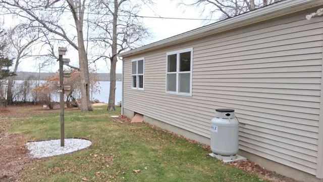 a kitchen with kitchen island a stove a sink and a window