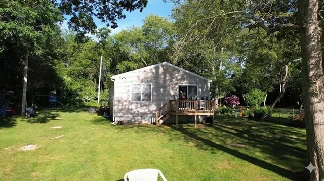 a view of backyard with swimming pool