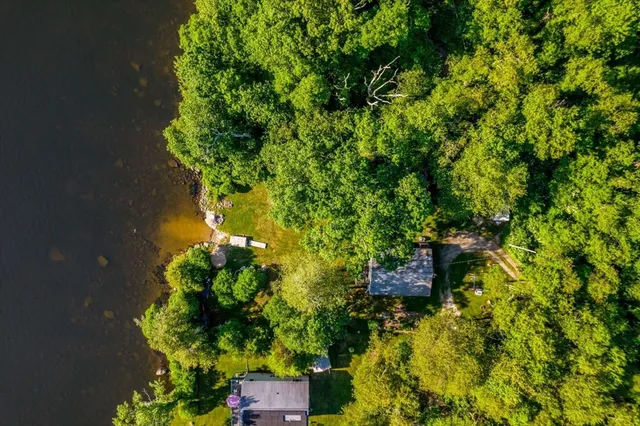 a bathroom with a bathtub and a mirror