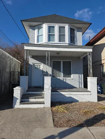 a front view of a house with a garage