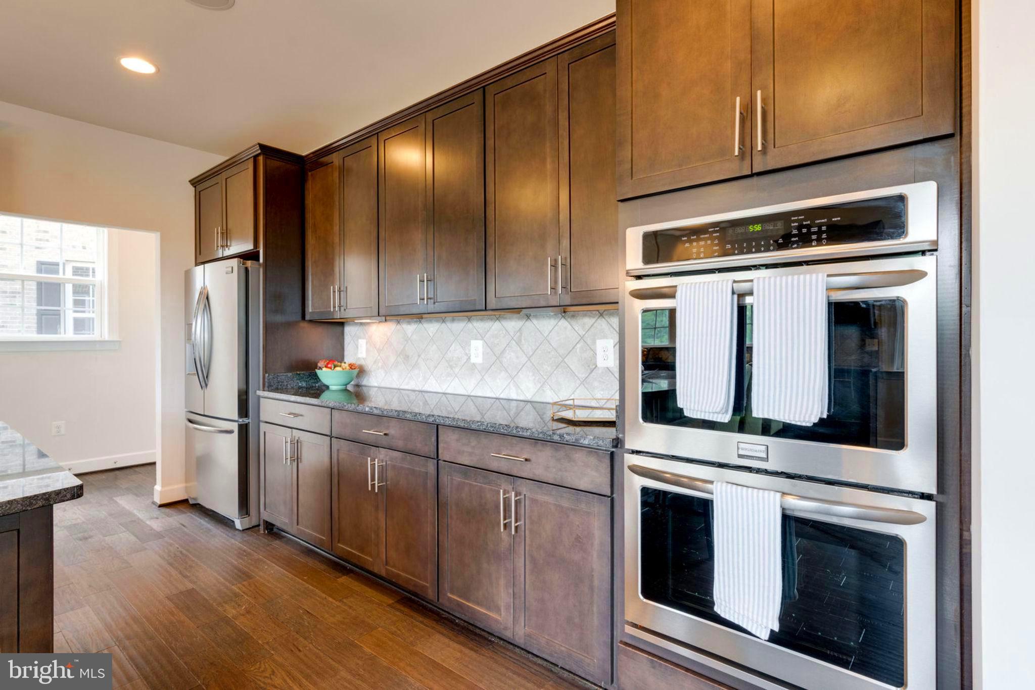 7516 Tangerine Place Lorton, VA 22079 - Photo 12 of 38 Ample Counter Tops and Cabinets