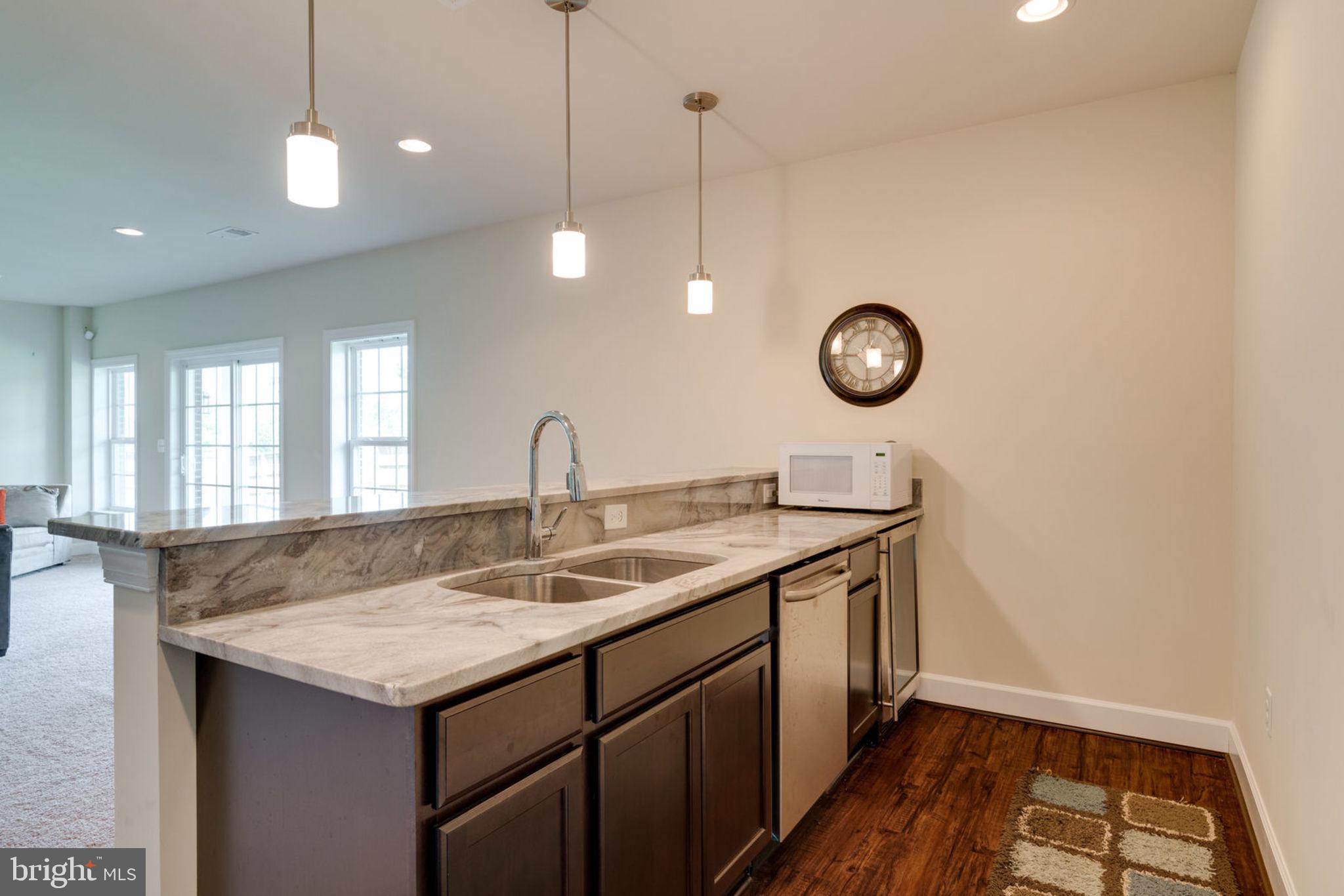 7516 Tangerine Place Lorton, VA 22079 - Photo 31 of 38 Built in dishwasher, sink and fridge