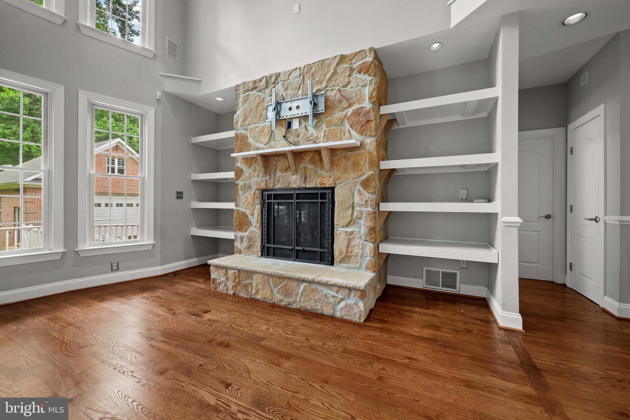 12221 Jerusalem Road Kingsville, MD 21087 - Photo 39 of 66 a view of an empty room with wooden floor fireplace and a window
