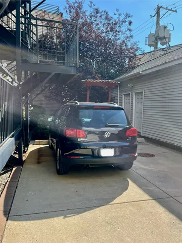 a car parked in front of a house