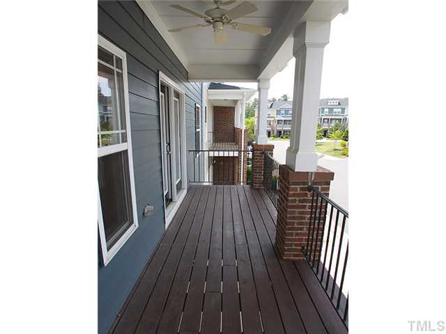231 Broadgait Brae Road Cary, NC 27519 - Photo 2 of 3 a view of a hallway with wooden floor and furniture