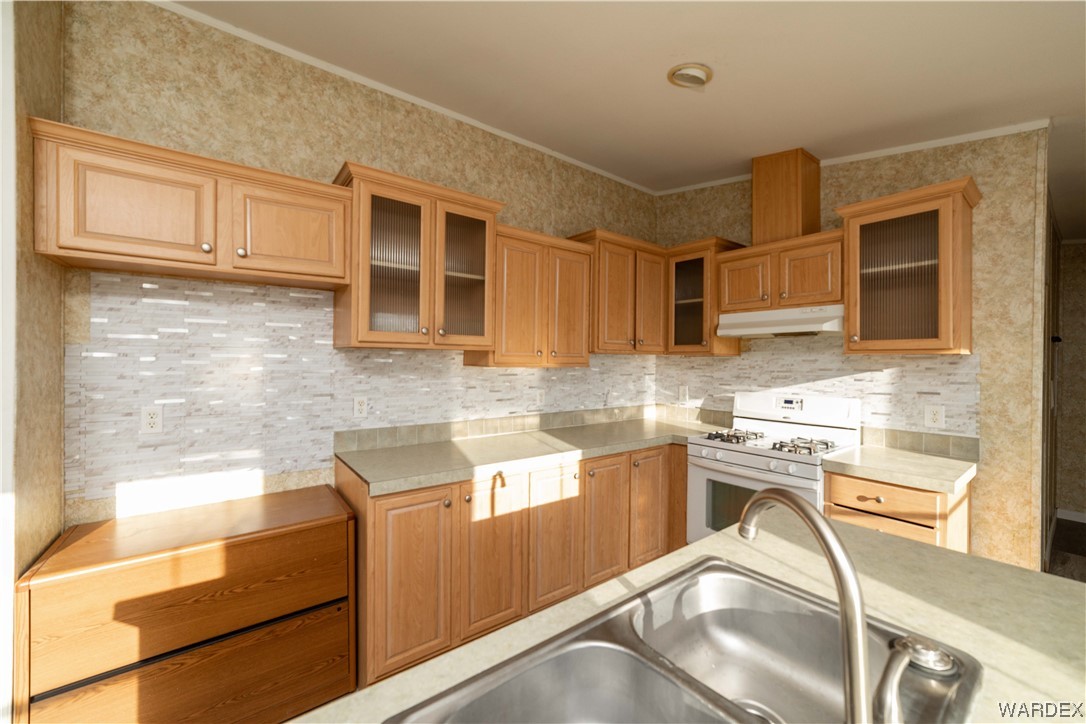 3329 Heber Road Golden Valley, AZ 86413 - Photo 15 of 52 a kitchen with stainless steel appliances granite countertop a sink and cabinets