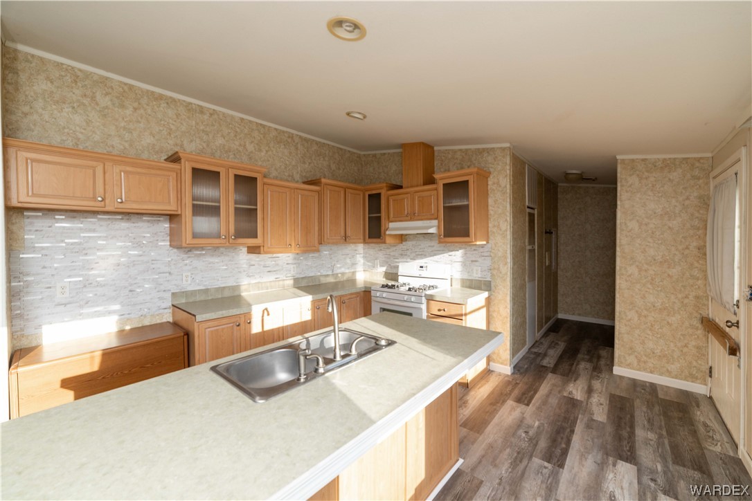 3329 Heber Road Golden Valley, AZ 86413 - Photo 16 of 52 a living room with stainless steel appliances kitchen island granite countertop furniture and a wooden floor