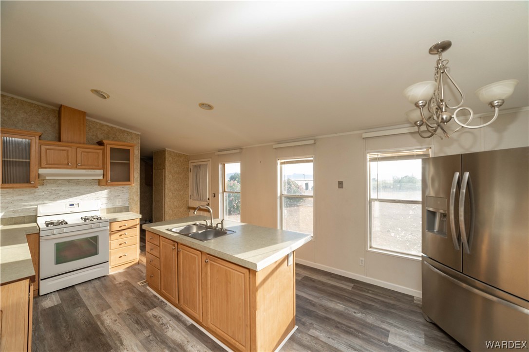 3329 Heber Road Golden Valley, AZ 86413 - Photo 19 of 52 a kitchen with stainless steel appliances granite countertop a sink stove and refrigerator