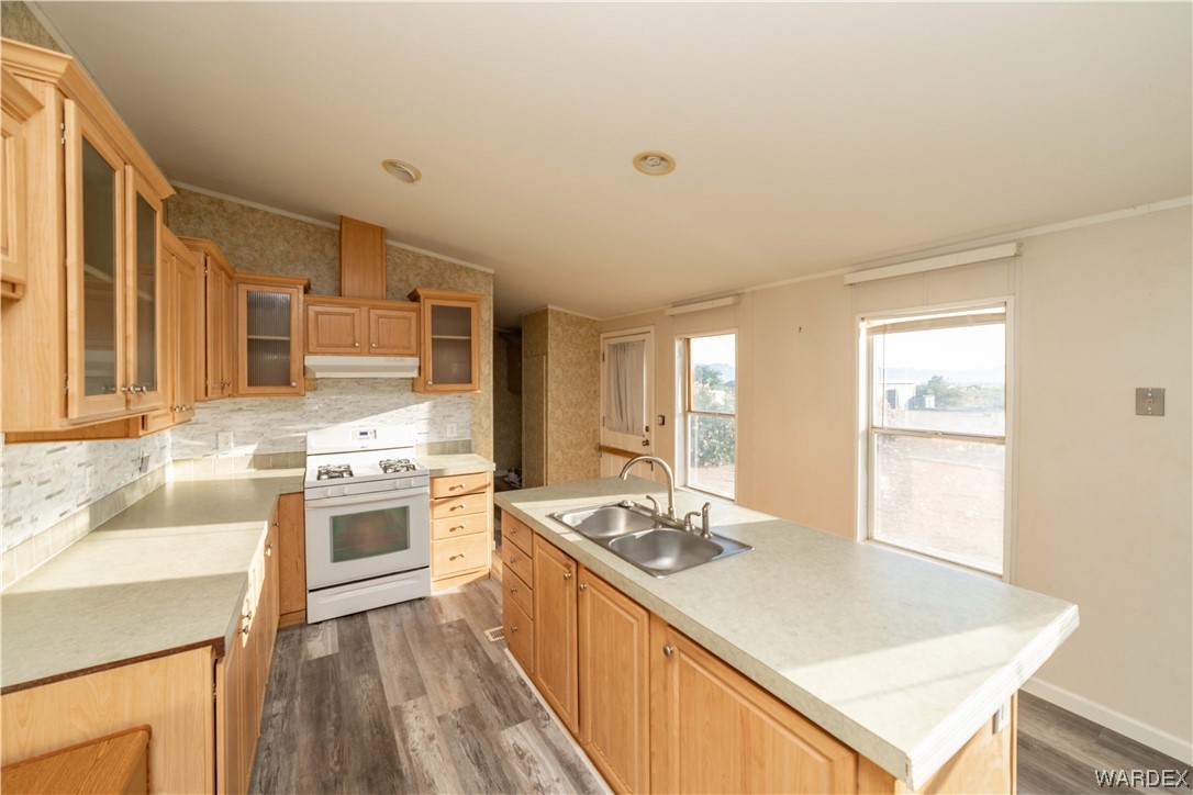 3329 Heber Road Golden Valley, AZ 86413 - Photo 20 of 52 a kitchen with stainless steel appliances granite countertop a sink stove and refrigerator