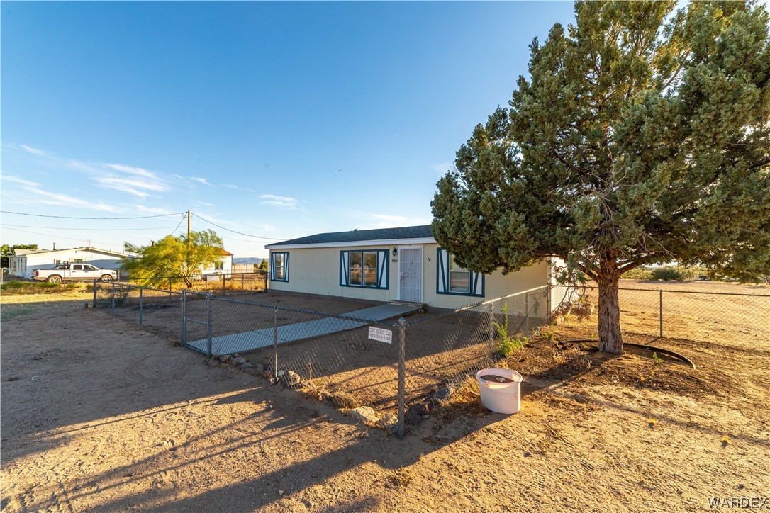 3329 Heber Road Golden Valley, AZ 86413 - Photo 2 of 52 a view of a house with a yard