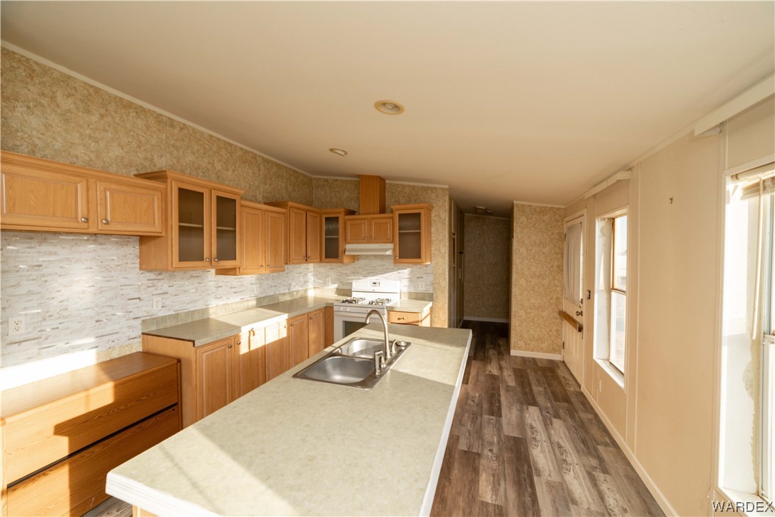 3329 Heber Road Golden Valley, AZ 86413 - Photo 21 of 52 a kitchen with a sink a stove and a refrigerator