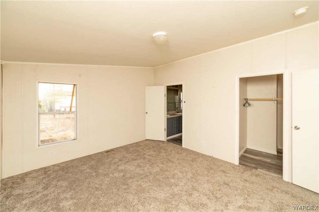 3329 Heber Road Golden Valley, AZ 86413 - Photo 38 of 52 an empty room with windows