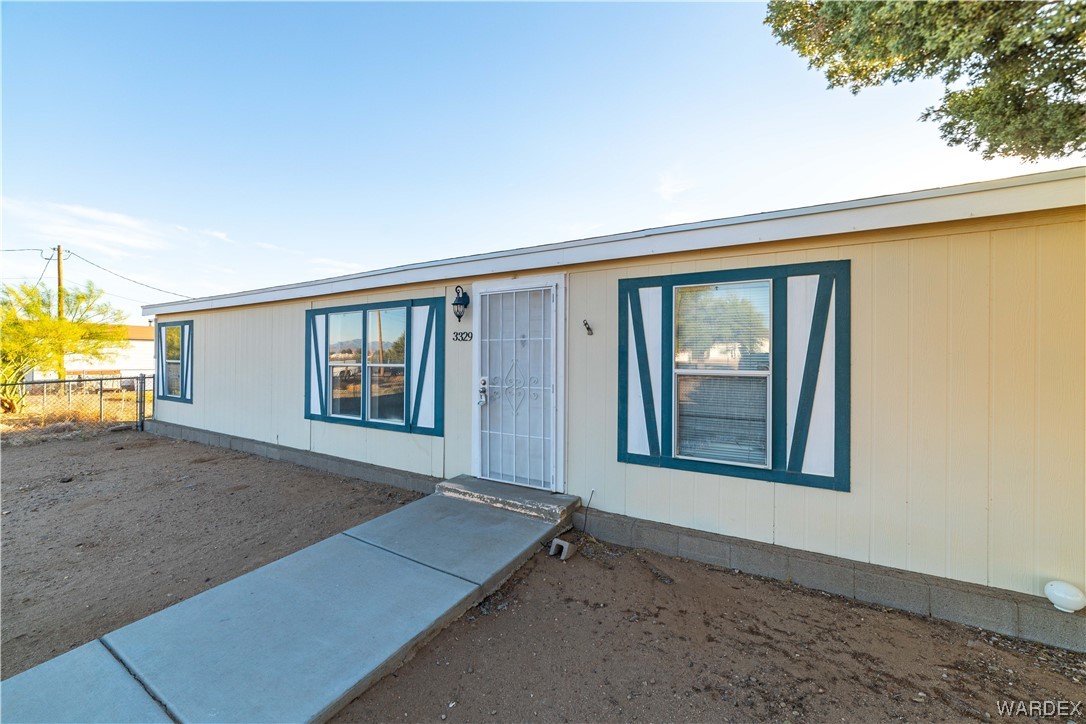 3329 Heber Road Golden Valley, AZ 86413 - Photo 5 of 52 an empty room with a empty space and windows