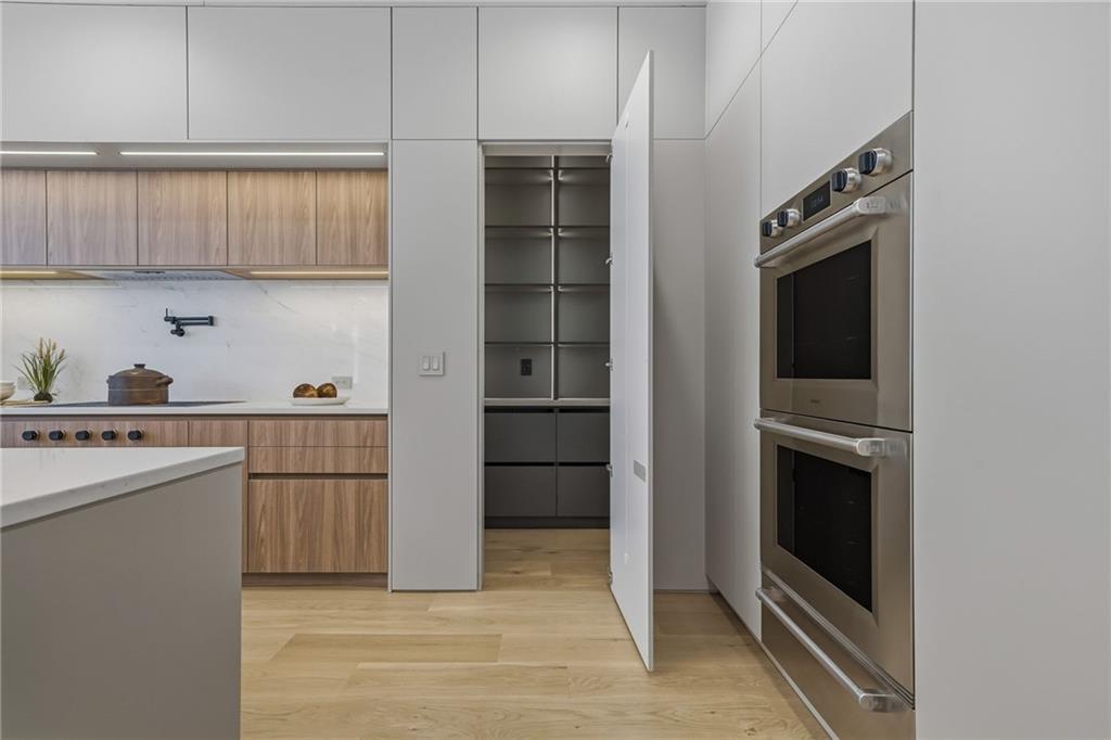 1185 Houston Mill Road Northeast Atlanta, GA 30329 - Photo 17 of 78 a kitchen with white cabinets and white appliances