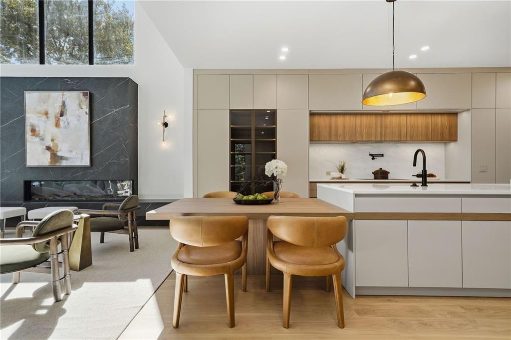 1185 Houston Mill Road Northeast Atlanta, GA 30329 - Photo 23 of 78 a kitchen with a table chairs stove and cabinets