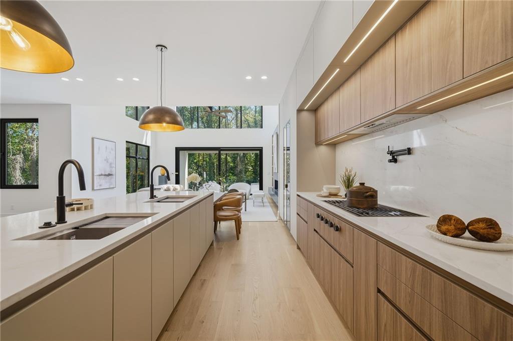 1185 Houston Mill Road Northeast Atlanta, GA 30329 - Photo 24 of 92 a kitchen with stainless steel appliances granite countertop a sink a stove and a wooden floors