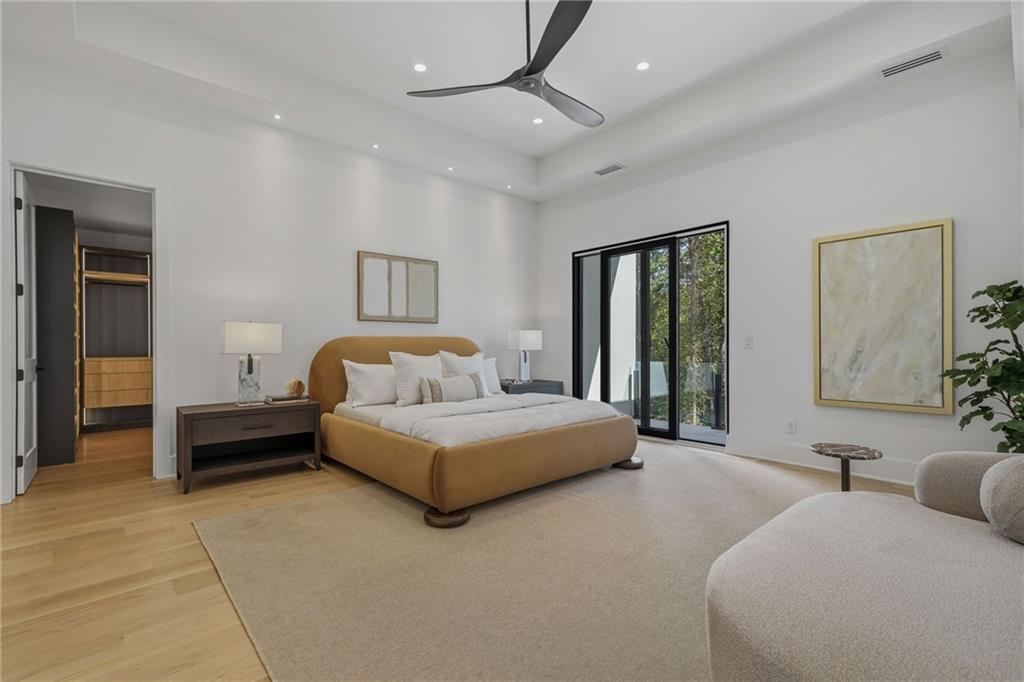 1185 Houston Mill Road Northeast Atlanta, GA 30329 - Photo 41 of 78 a spacious bedroom with a bed and a couch