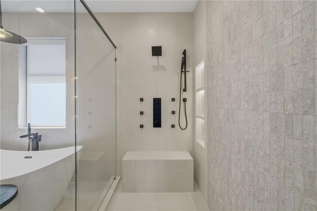 1185 Houston Mill Road Northeast Atlanta, GA 30329 - Photo 45 of 78 a bathroom with a bathtub and a sink