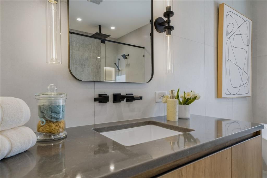 1185 Houston Mill Road Northeast Atlanta, GA 30329 - Photo 47 of 78 a bathroom with a sink and a mirror