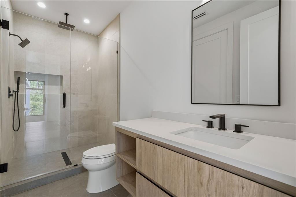 1185 Houston Mill Road Northeast Atlanta, GA 30329 - Photo 54 of 78 a bathroom with a sink a toilet and shower