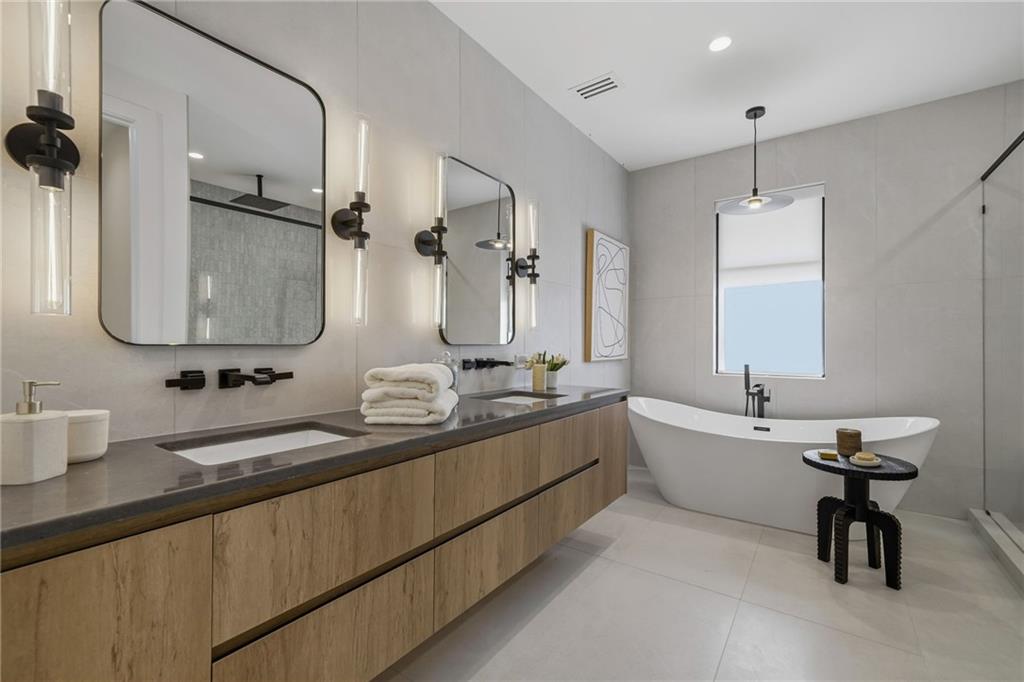 1185 Houston Mill Road Northeast Atlanta, GA 30329 - Photo 55 of 92 a bathroom with double vanity sinks and a mirror