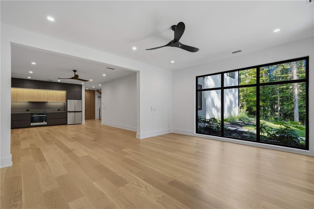 1185 Houston Mill Road Northeast Atlanta, GA 30329 - Photo 61 of 78 a view of an empty room with a sliding door and a window