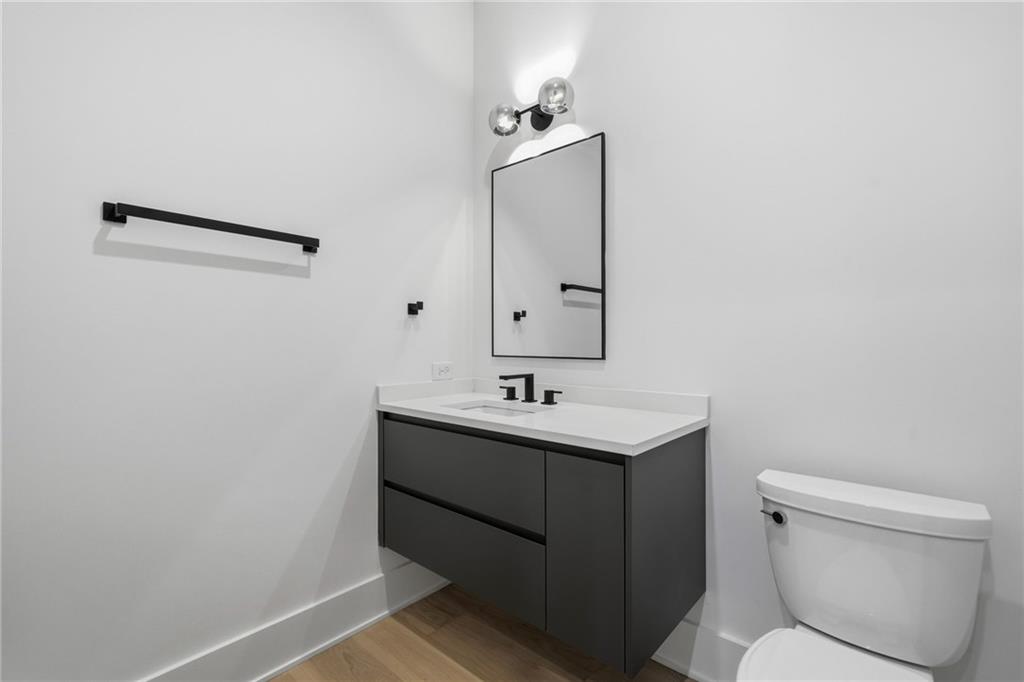 1185 Houston Mill Road Northeast Atlanta, GA 30329 - Photo 67 of 78 a bathroom with a sink toilet and mirror