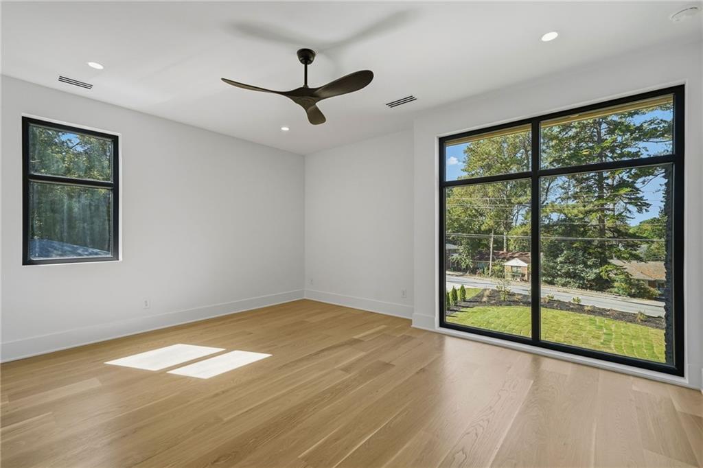 1185 Houston Mill Road Northeast Atlanta, GA 30329 - Photo 68 of 92 a view of empty room with wooden floor and fan