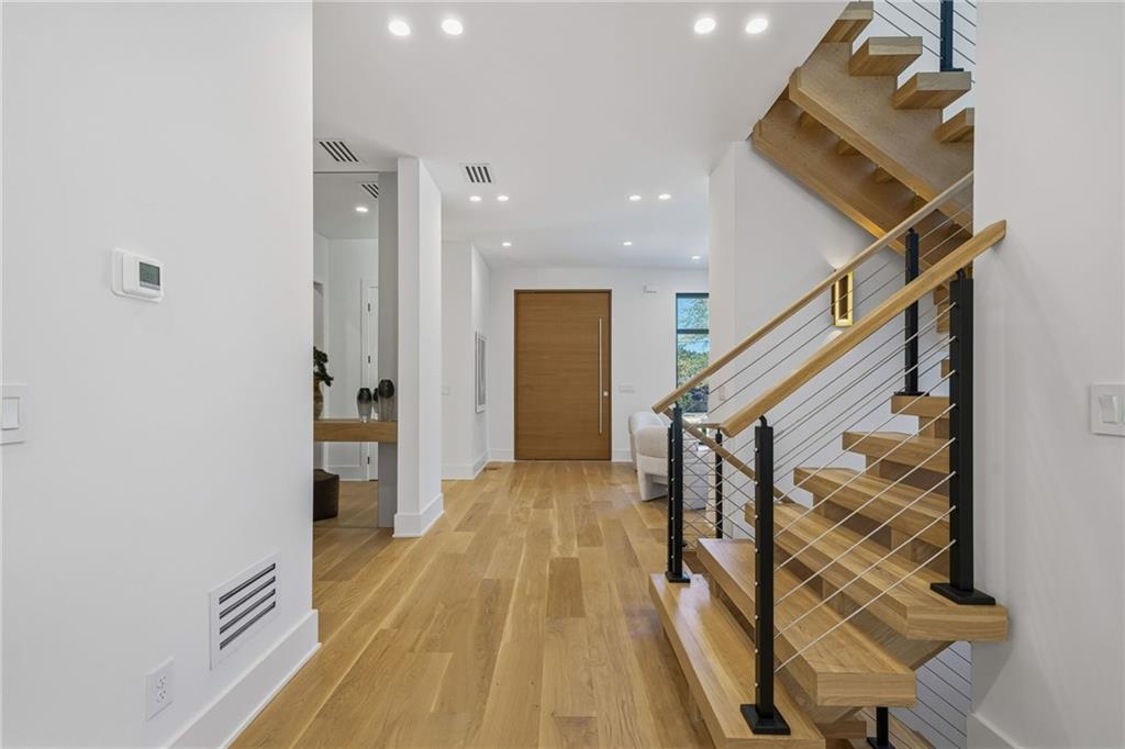 1185 Houston Mill Road Northeast Atlanta, GA 30329 - Photo 8 of 78 a view of hallway with wooden floor