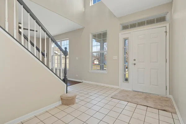 a view of an entryway with wooden floor