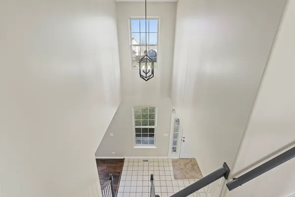 an entryway with wooden floor