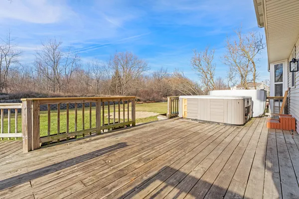 a view of wooden deck and a lake view