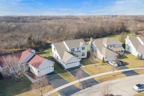 an aerial view of a house with lake view