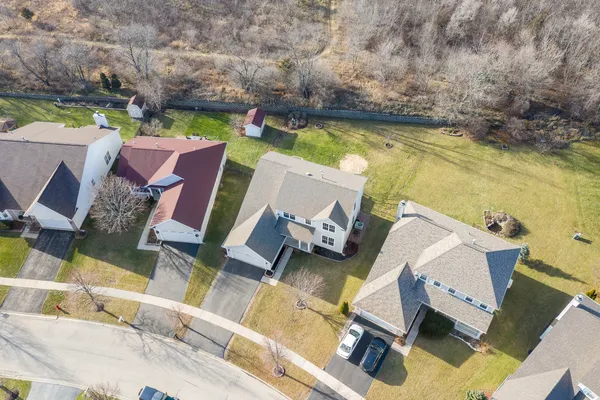 an aerial view of a house with a ocean view