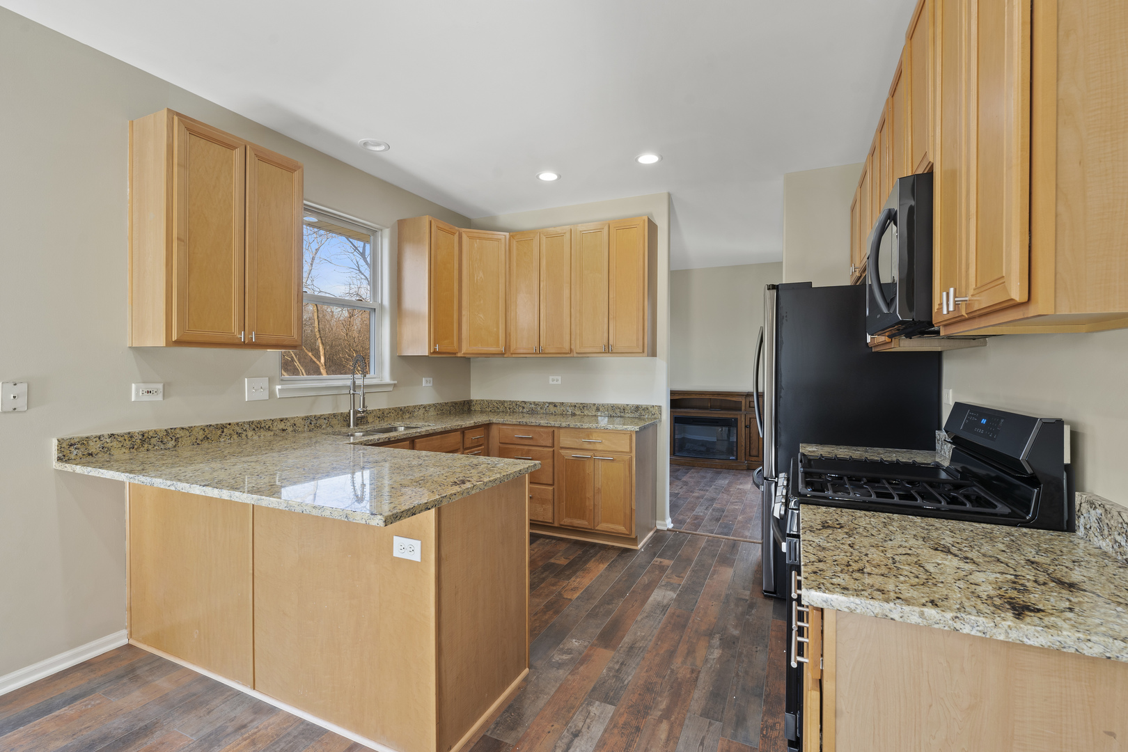 32804 Bending Creek Road McHenry, IL 60051 - Photo 9 of 42 a kitchen with a sink stove top oven and refrigerator