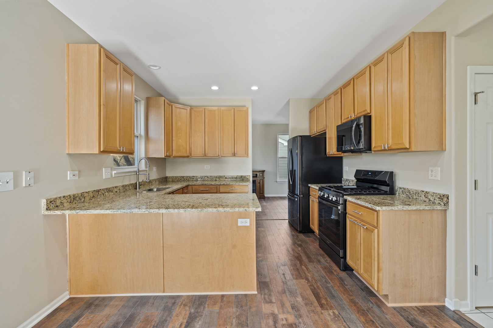 32804 Bending Creek Road McHenry, IL 60051 - Photo 10 of 42 a kitchen with stainless steel appliances granite countertop a stove a sink a refrigerator a center island and cabinets