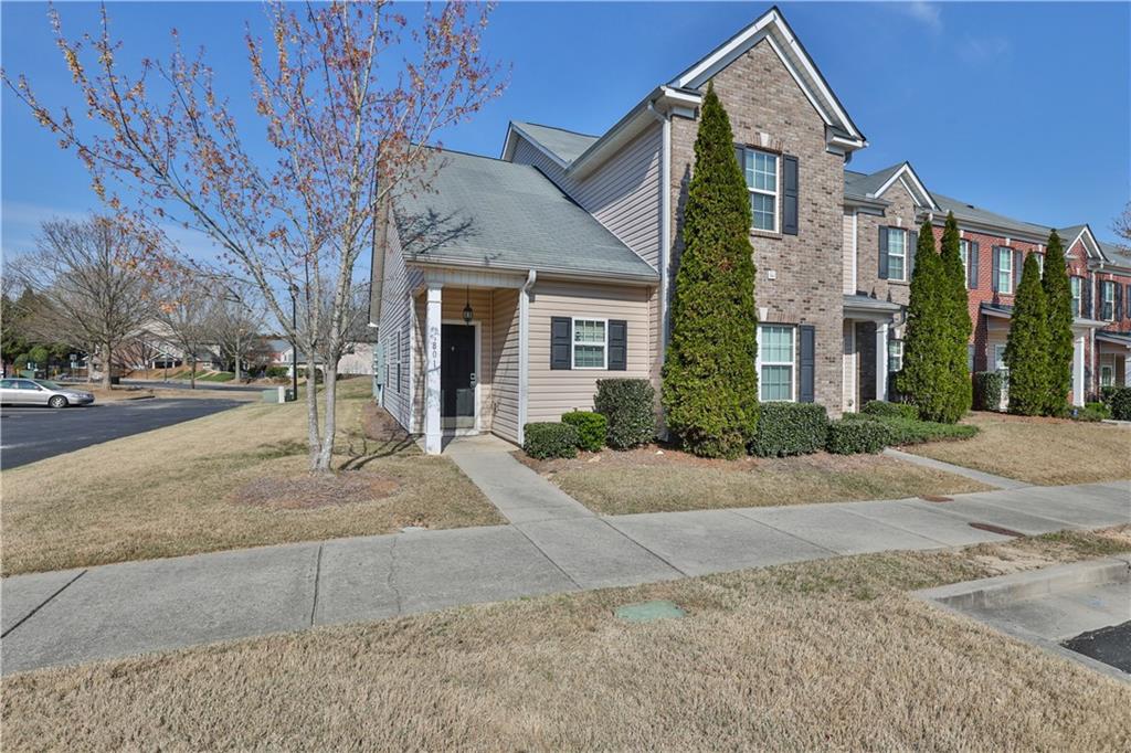2555 Flat Shoals Road, Unit 801 Atlanta, GA 30349 - Photo 1 of 1 front view of a house with a yard