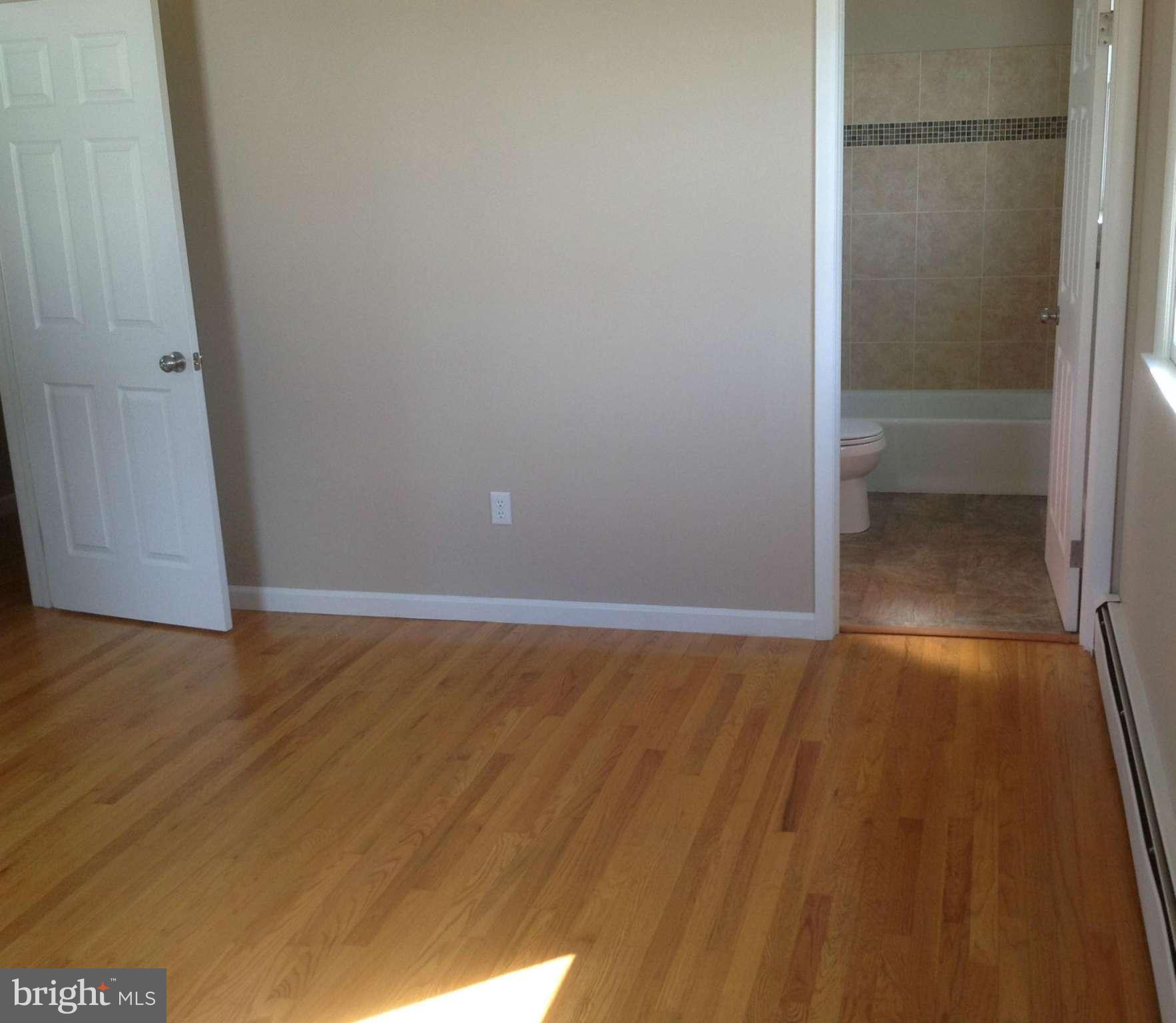 1218 Random Ridge Road Westminster, MD 21157 - Photo 8 of 15 a view of an empty room with wooden floor and closet
