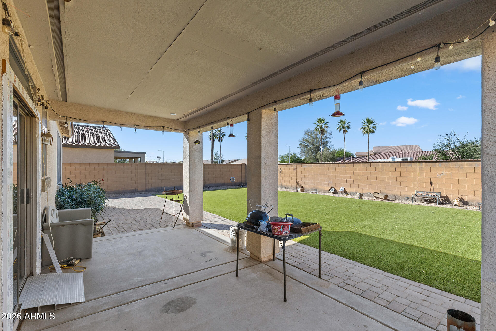 6718 West Darrel Road Laveen, AZ 85339 - Photo 44 of 49 a view of a chairs and table in patio with a yard