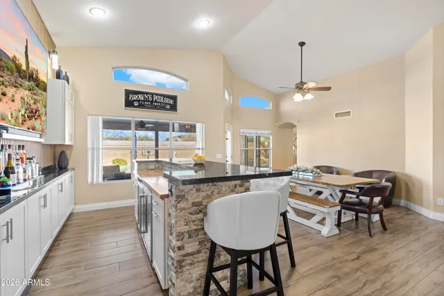 a kitchen with stainless steel appliances a sink stove refrigerator and cabinets