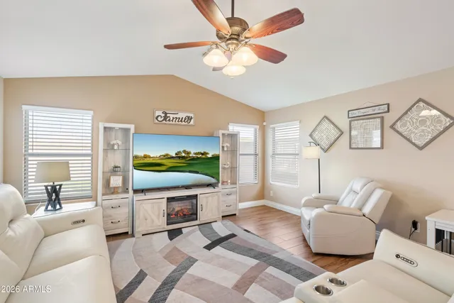 an aerial view of a house with swimming pool and patio