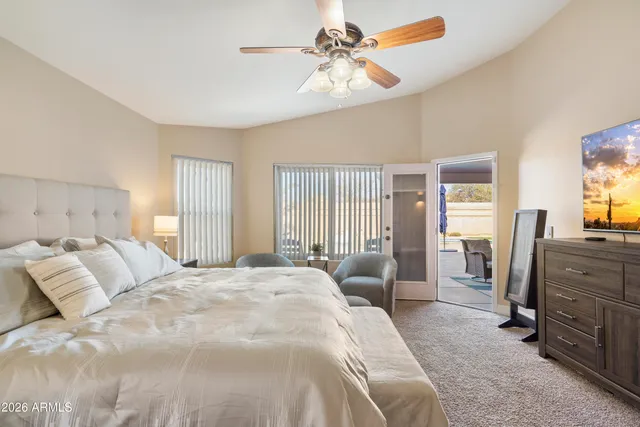 a view of a house with swimming pool and sitting area