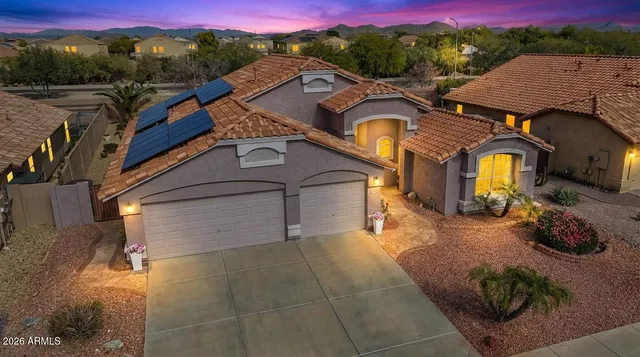 a front view of a house with parking area