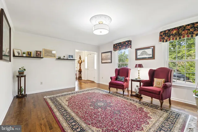 a living room with furniture and a rug
