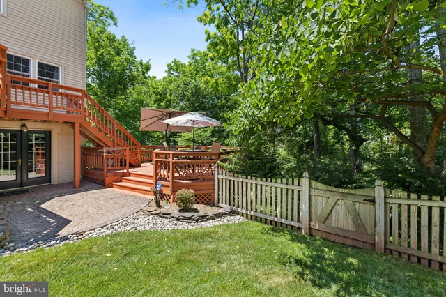 a view of a chair and table in front of house