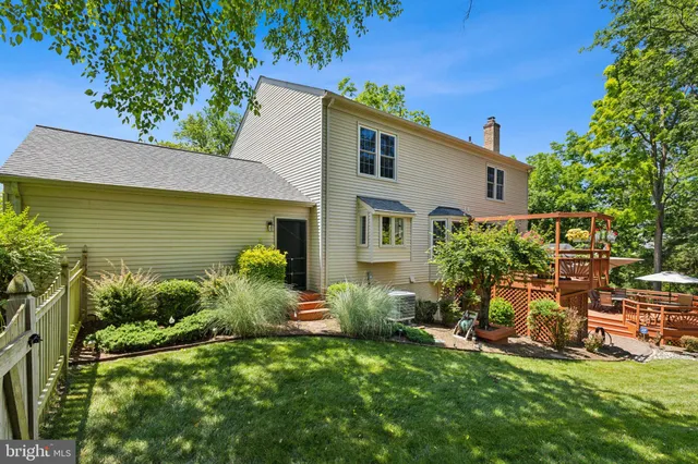 a front view of house with yard and outdoor seating
