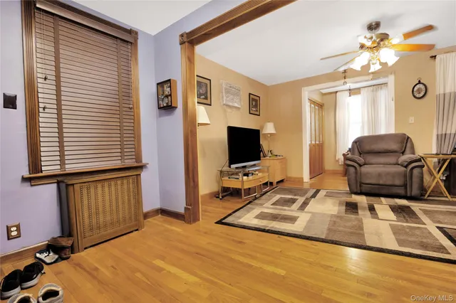 a room with a bed and a flat screen tv